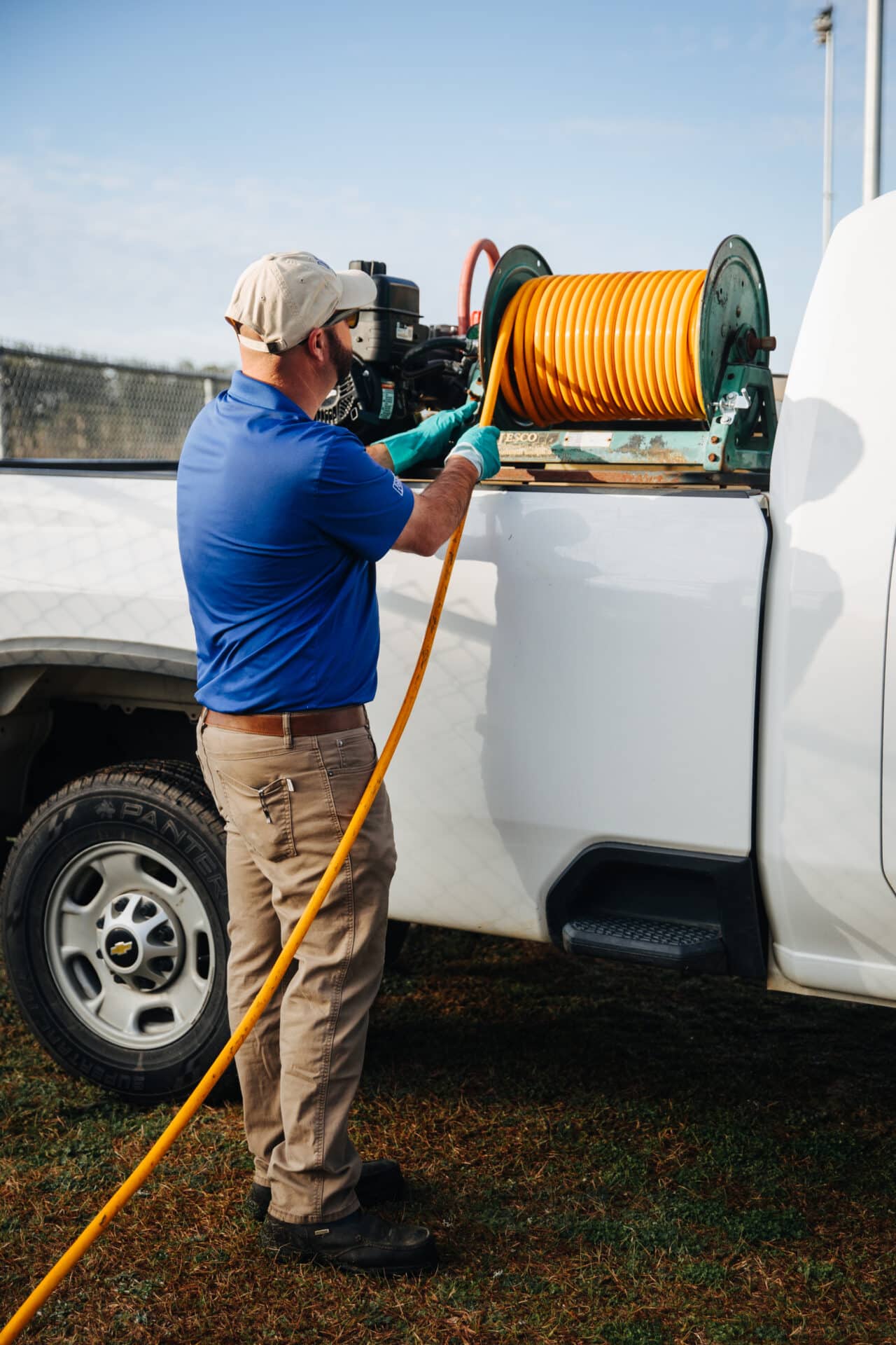 man getting cable from his work truck