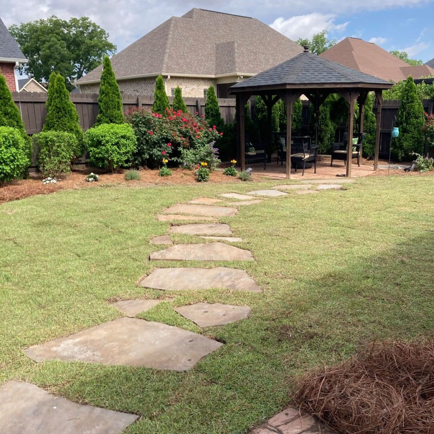 image of a concrete foot path in a residential back yard